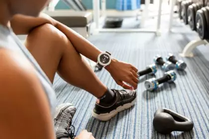 Using a smart watch while working out at the gym; health and fitness